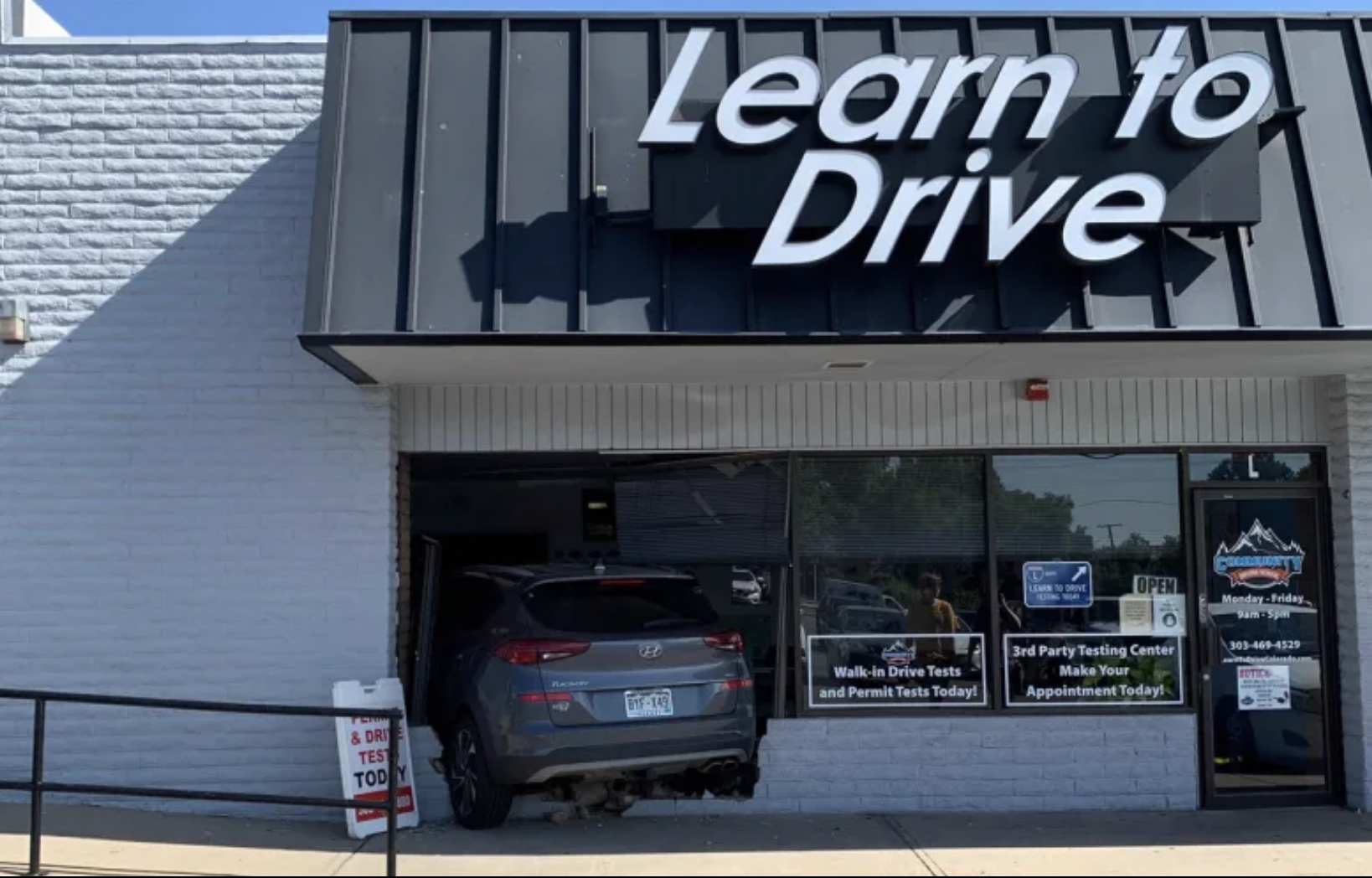 Driving Instructor Crashes Through Driving School